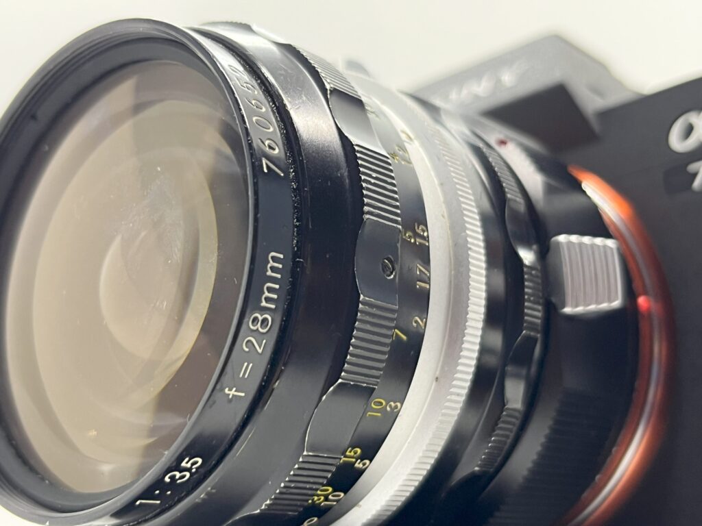 Photo of lens mounted (mirrorless camera example)