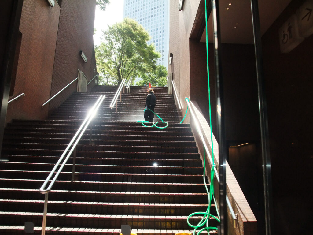 A man washing the stairs